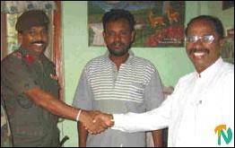 Mr. Gnanamuthu Krishnapillai (right) and Brigadier S.R. Balasuriya.