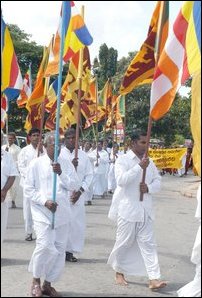 Nationalists carrying Sri Lankan and Buddhist flags towards BMICH Conference hall