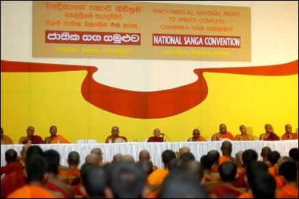 Organising committee monks seated at the stage