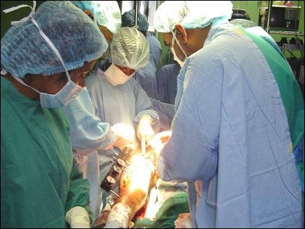 Orthopaedic Surgeon from Malaysia, Dr Sivananthan, performing surgery on fractured leg of a patient.