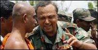 Sri Lanka Army Chief of Staff Major General Nandha Mallawarchchi talks with Athuraliye Rathana Thera (L) [Photo: Reuters]